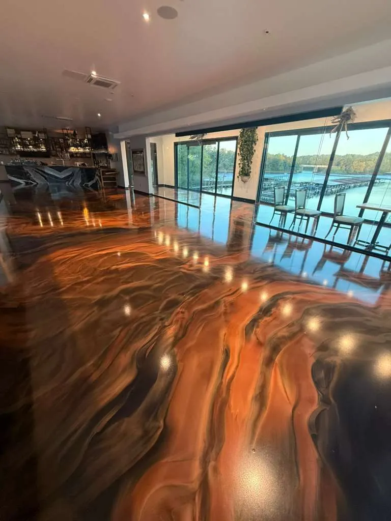 Amber Lava metallic epoxy floor in a lakefront great room